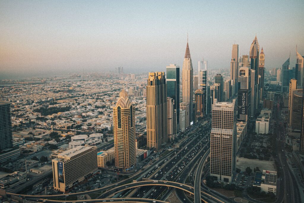 Stunning aerial shot of Dubai's modern skyline with iconic skyscrapers at dusk.
