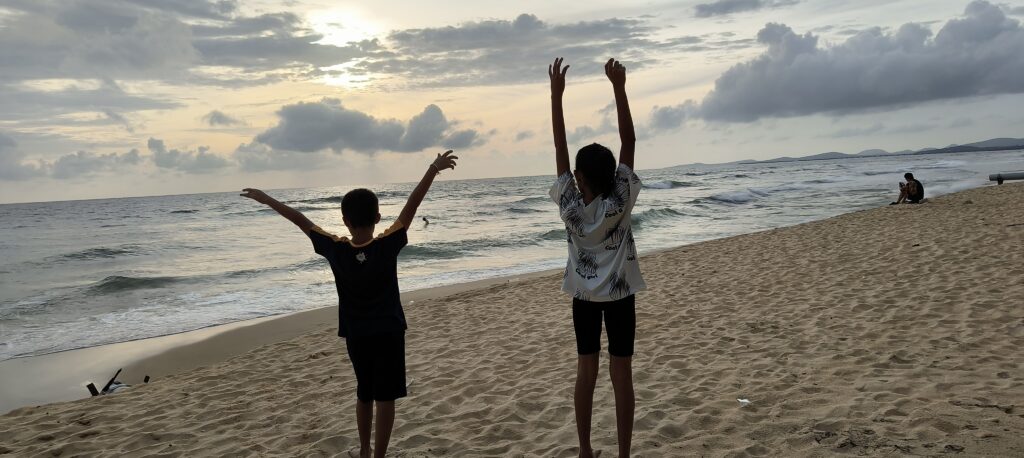 Kids enjoying sunset at beach